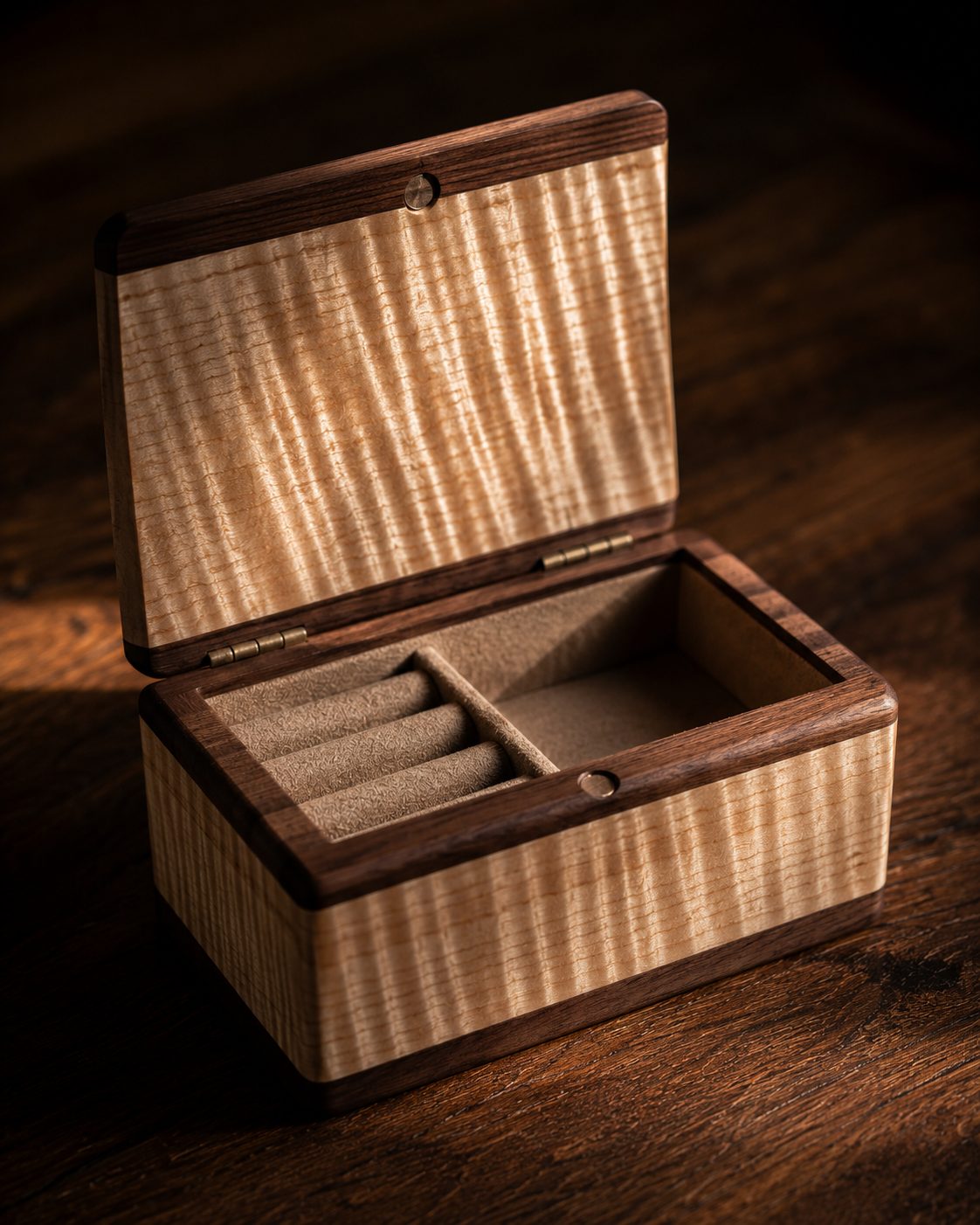 Open curly maple keepsake box with walnut trim and felt-lined ring slots